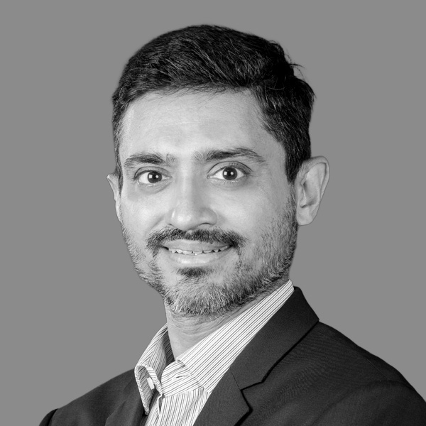 Black and white headshot of Chirag Nanavati, Managing Director at Asset Vantage, helping families manage complex wealth, investments, and accounting with technology-driven solutions